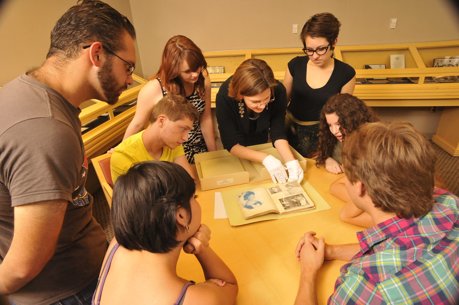 Students in a history class looking at archival materials