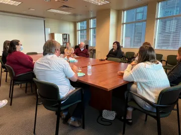 group of people around a large table