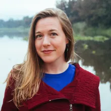 Beth Tellman standing in front of a body of water