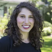 Woman with dark curly hair