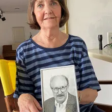 June Webb-Vignery holds a photo of her late husband, Bob Vignery.