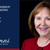 Photo of Jan Lesher on the right, wearing a red blouse. On the left is a blue background with the U of A logo and "Jan Lesher, Alumni of the Year" 